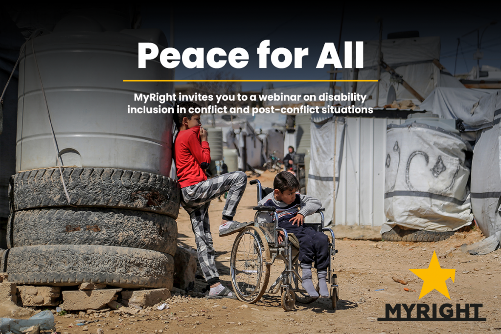 boy sitting in a wheelchair next to him stands brother they are in a refugee camp